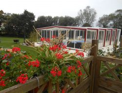 Holiday cottage with covered pool in Brittany near Laz